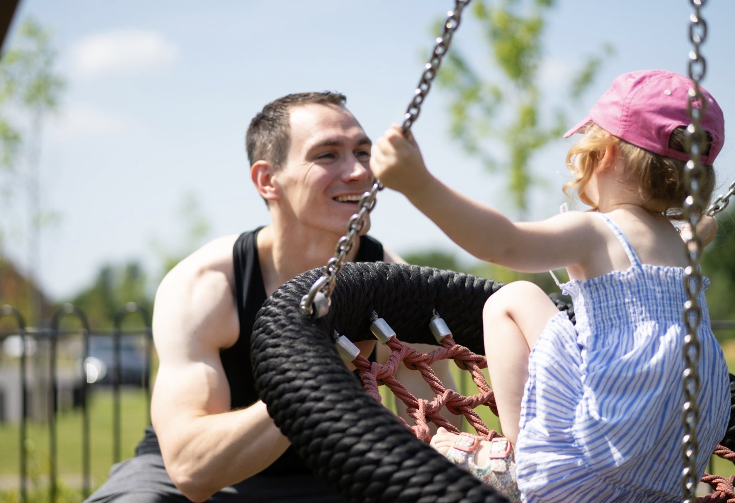 Rob and his daughter on a swing