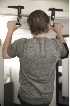 man doing pullups on crossgrips