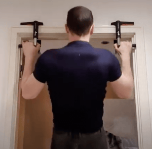 Rob doing pullups in the doorway using crossgrips