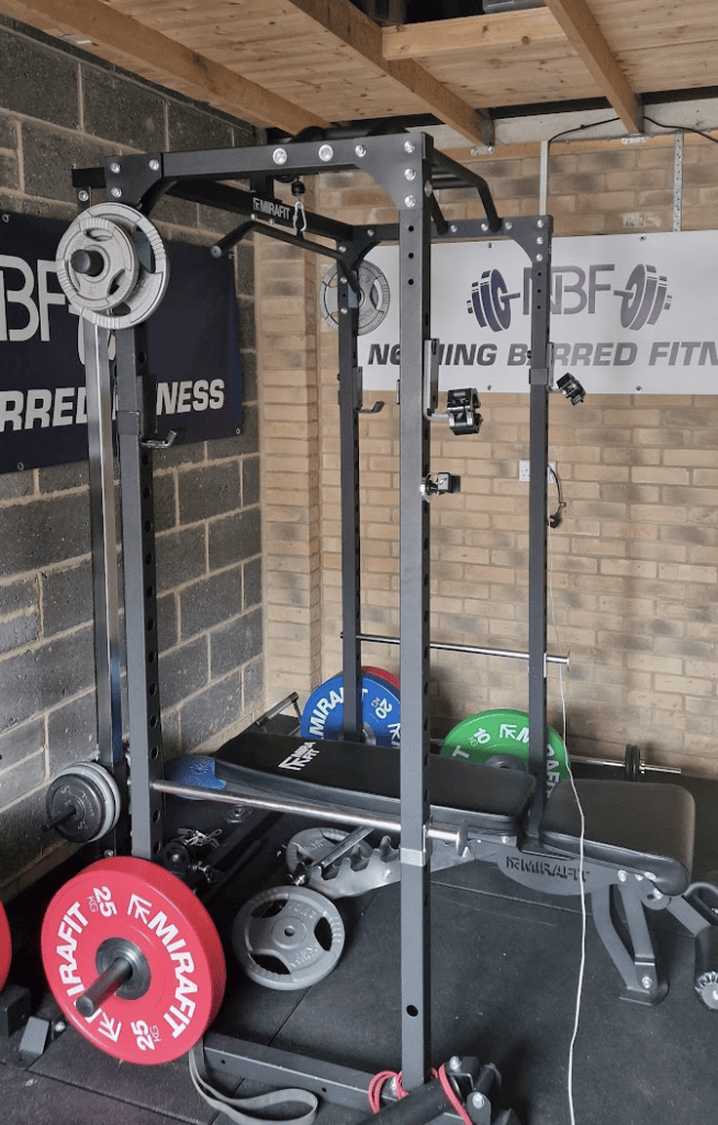 home gym with barbell and power rack